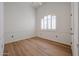 Bright bedroom with a large window and wood-look floors at 4525 N 22Nd St # 404, Phoenix, AZ 85016