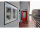 Modern condo entry with a striking red door, exterior number, and architectural window at 4525 N 22Nd St # 404, Phoenix, AZ 85016