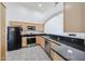 Bright kitchen featuring granite countertops, stainless steel appliances, and wooden cabinets at 4525 N 22Nd St # 404, Phoenix, AZ 85016
