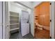 Convenient laundry closet with shelving and adjacent bathroom access at 4525 N 22Nd St # 404, Phoenix, AZ 85016