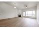 Bright living room features wood floors, fireplace, and sliding doors to a balcony at 4525 N 22Nd St # 404, Phoenix, AZ 85016
