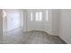 Bright living room with tiled floors and shuttered windows at 4525 N 22Nd St # 404, Phoenix, AZ 85016