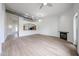Inviting living room with wood floors, fireplace, and open access to the kitchen area at 4525 N 22Nd St # 404, Phoenix, AZ 85016