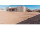 Backyard view of new construction home with large lot at 23120 W Skinner Rd, Wittmann, AZ 85361