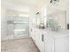 Elegant bathroom with double vanity, soaking tub, and walk-in shower at 23120 W Skinner Rd, Wittmann, AZ 85361