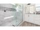 Modern bathroom boasts a large shower and white cabinetry at 23120 W Skinner Rd, Wittmann, AZ 85361