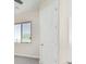 Spacious bedroom with gray carpet and a large window at 23120 W Skinner Rd, Wittmann, AZ 85361