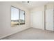 Bedroom with large window and closet at 23120 W Skinner Rd, Wittmann, AZ 85361