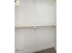 Custom closet with hanging rod and shelving at 23120 W Skinner Rd, Wittmann, AZ 85361