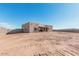 Newly built home exterior with stucco and large windows at 23120 W Skinner Rd, Wittmann, AZ 85361