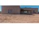 Back exterior view of stucco home at 23120 W Skinner Rd, Wittmann, AZ 85361