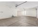 Bright and spacious garage with high ceilings at 23120 W Skinner Rd, Wittmann, AZ 85361