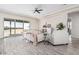 Living room with wood-look floors, neutral color scheme, and sliding glass doors at 23120 W Skinner Rd, Wittmann, AZ 85361