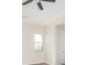 Living room with ceiling fan and large windows at 23120 W Skinner Rd, Wittmann, AZ 85361