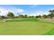 Scenic view of the well-maintained golf course with lush green grass and clear blue sky at 9502 W Mcrae Way, Peoria, AZ 85382