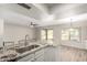 Bright, airy kitchen with stainless steel appliances and granite countertops with an island sink at 9502 W Mcrae Way, Peoria, AZ 85382
