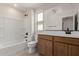 Bathroom featuring a tub/shower combo, modern vanity, and neutral finishes at 15598 S 181St Dr, Goodyear, AZ 85338