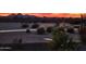 Desert landscape with gravel pathway and sunset view in the background at 35532 N Sunset Trl, San Tan Valley, AZ 85140