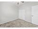 Well-lit bedroom featuring neutral walls and carpet at 3810 N Mateo Dr, Eloy, AZ 85131