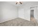 Bedroom with neutral walls, carpet, and double doors at 3810 N Mateo Dr, Eloy, AZ 85131