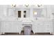 Bathroom with a double vanity, spacious counters, and elegant white cabinets at 10746 E Whitethorn Dr, Scottsdale, AZ 85262