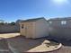 Tan colored storage shed in backyard at 12737 W Ventura St, El Mirage, AZ 85335