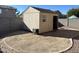 Tan colored storage shed in backyard at 12737 W Ventura St, El Mirage, AZ 85335