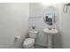 Clean bathroom with pedestal sink and oval mirror at 1718 W Colter St # 195, Phoenix, AZ 85015