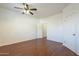 Bedroom with wood flooring, ceiling fan and double door closet at 1718 W Colter St # 195, Phoenix, AZ 85015