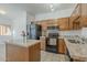 Kitchen with granite countertops and island at 1718 W Colter St # 195, Phoenix, AZ 85015