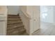 Carpeted stairs with a neutral color palette at 1718 W Colter St # 195, Phoenix, AZ 85015