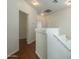 Upper hallway with wood flooring, access to bedrooms and bathroom at 1718 W Colter St # 195, Phoenix, AZ 85015