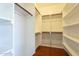 Spacious walk-in closet with wood flooring and shelving at 1718 W Colter St # 195, Phoenix, AZ 85015