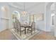 Elegant dining room with chandelier and built-in shelving at 10914 E Cinder Cone Trl, Scottsdale, AZ 85262