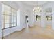 Spacious dining area with large windows and chandelier at 10914 E Cinder Cone Trl, Scottsdale, AZ 85262