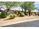 Desert landscaping surrounds this beautiful one-story home with a large front yard at 10914 E Cinder Cone Trl, Scottsdale, AZ 85262