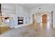 Open concept living room with a stone fireplace and high ceilings at 10914 E Cinder Cone Trl, Scottsdale, AZ 85262