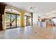 Open living space with kitchen, fireplace and view of the backyard at 10914 E Cinder Cone Trl, Scottsdale, AZ 85262