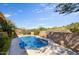 Inviting kidney-shaped pool with a serene desert landscape at 10914 E Cinder Cone Trl, Scottsdale, AZ 85262