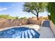 Refreshing pool with tiled steps and a beautiful desert backdrop at 10914 E Cinder Cone Trl, Scottsdale, AZ 85262