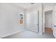 This bedroom features neutral walls, carpet, a window and a closet at 14189 W Sand Hills Rd, Surprise, AZ 85387