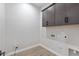 This laundry room features upper cabinets at 14189 W Sand Hills Rd, Surprise, AZ 85387