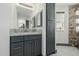 Bathroom vanity with granite countertop and dark grey cabinets at 28301 N 154Th St, Scottsdale, AZ 85262