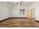 Bright bedroom featuring wood-look floors and a ceiling fan at 28301 N 154Th St, Scottsdale, AZ 85262