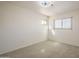 Neutral bedroom with carpet, two windows and ample natural light at 5249 E Hobart St, Mesa, AZ 85205