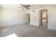 Expansive bedroom with carpeted floors, ceiling fan, and easy access to other rooms at 5249 E Hobart St, Mesa, AZ 85205