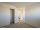 Bedroom featuring closet with sliding doors and a door leading to the hallway at 5249 E Hobart St, Mesa, AZ 85205