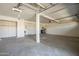 Functional garage space with ample room for parking and storage, plus a utility area at 5249 E Hobart St, Mesa, AZ 85205