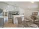 View of the kitchen and dining area with tile flooring and modern lighting at 5249 E Hobart St, Mesa, AZ 85205