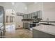 Bright kitchen with gray cabinetry, stainless steel appliances, and mosaic tile backsplash at 5249 E Hobart St, Mesa, AZ 85205